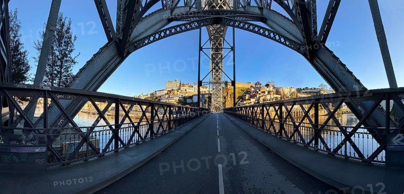 Panorama of the Dom Luis I arched bridge designed by Théophile Seyrig, view from the lower level towards Porto, Portugal