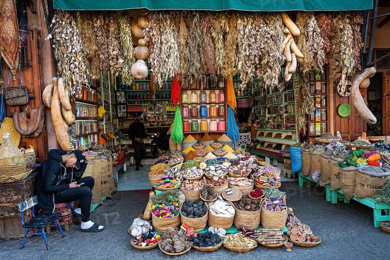 Various dried herbs, spices, soap and fragrances are on display for sale at a sales stand, spice dealer, quack, herborist, souk, bazaar, Marrakech, Maghreb, Morocco, North Africa