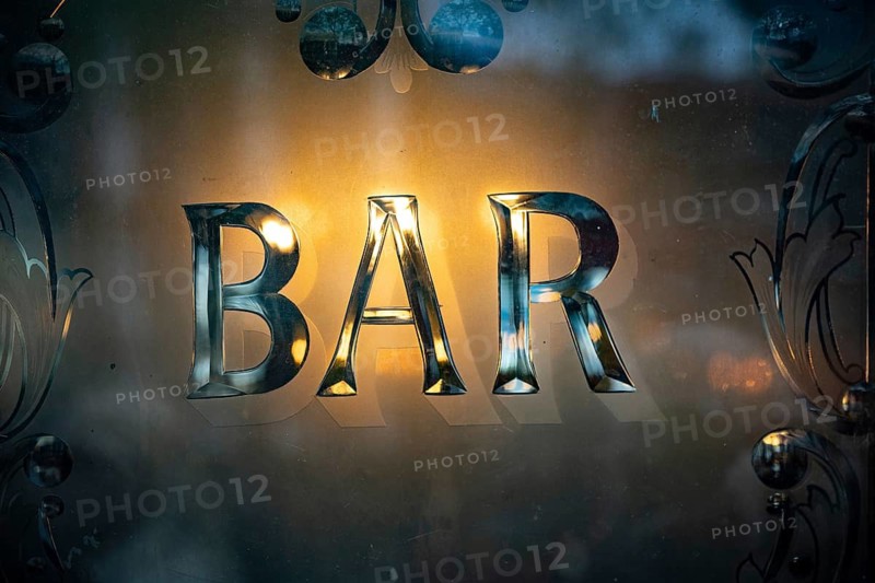 A British pub window design with the word Bar displayed, outside a traditional London Pub, UK