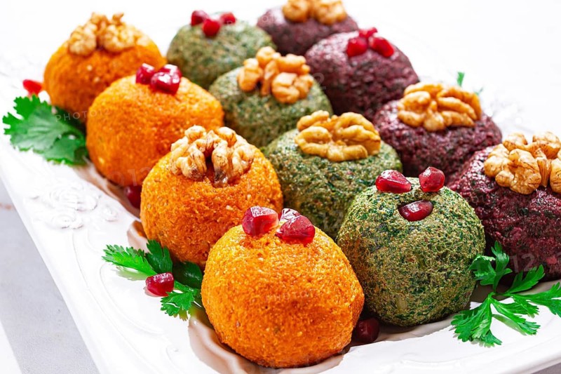 Assortment of Pkhali, pumpkin, spinach and beetroot, Georgian dish, on a white plate, appetizer with nuts and spices, no people, homemade