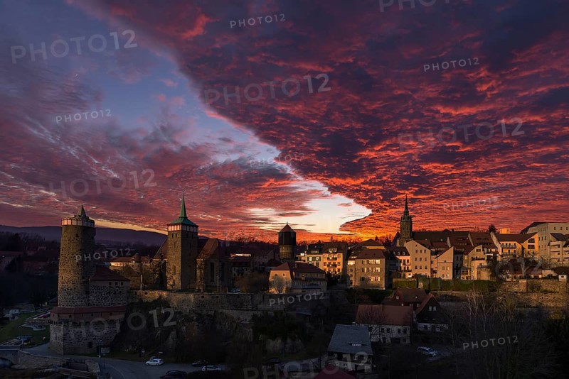 A red evening sky with cumulus clouds (stratocumulus) over the old town of Bautzen, Upper Lusatia, Saxony, Germany