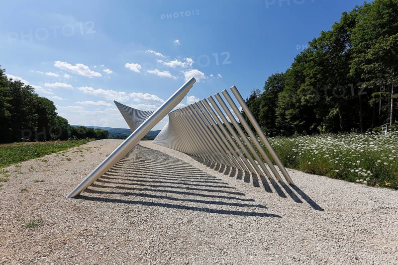 Art in public space, sculpture made of aluminum profile pipes by artist Martin Burchard, life's horizon path near Mundingen, light and shadow, gravel, clouds, blue sky, walk-in art, paths of reflection and refreshment on the Ehinger Alb, Baden-Württemberg, Germany