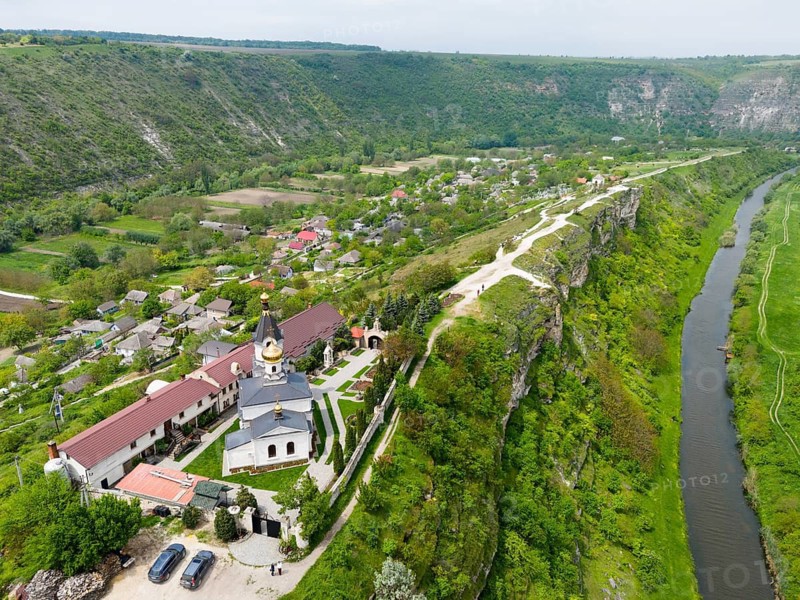 A church on top of a gorge with a river and green landscape in the area, aerial view, St. Mary's Church, Butuceni, Old Orhei, Orheiul Vechi, Raut River, Raut, archaeological site, historical-landscape reserve, Orhei district, Republic of Moldova, Moldova