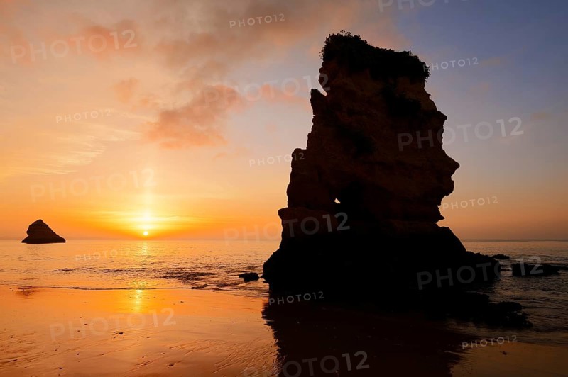 Rock formation on the coast at sunrise, Praia Dona Ana, Lagos, Algarve, Portugal