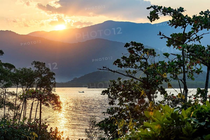 Sunset between the sea and the mountains of Bertioga on the coast of Sao Paulo, Bertioga, Sâo Paulo, Brazil