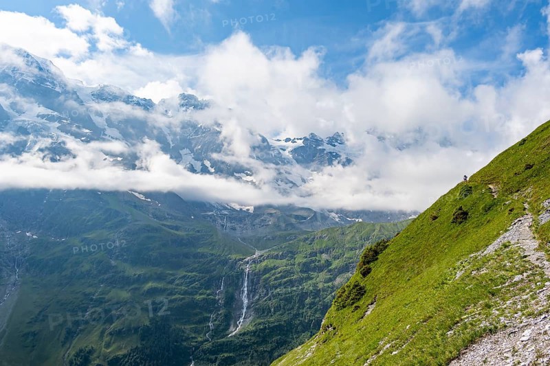 Picturesque mountain landscape with Schmadribachfall waterfall, Breithorn and Tschingelhorn mountain peaks, Bernese Alps, Bernese Oberland, Switzerland