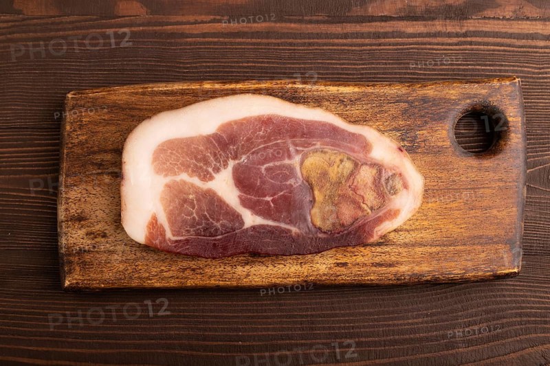 Dry-aged steak, Pork ham on brown wooden background. top view, flat lay, close up
