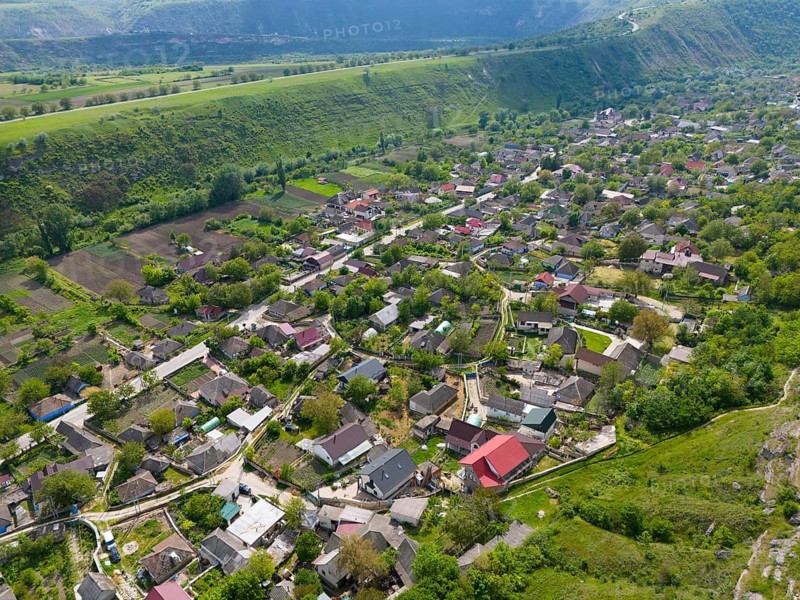 Rural village nestled in a green landscape with hilly environments, aerial view, view of Trebujeni, Old Orhei, Orheiul Vechi, archaeological site, protected landscape area, Orhei district, Republic of Moldova, Moldova