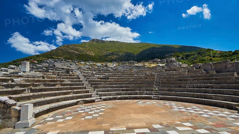 Ecclesiasterion, ancient amphitheatre with many rows of seats under blue sky with white clouds, ancient site, archaeological site, Messene, Messini, Messinia, southwest of the Peloponnese, odyssey, Odyssey, Odysseus, Ulysses, film, filming location, Matt Damon, Peloponnese, peninsula, Greece