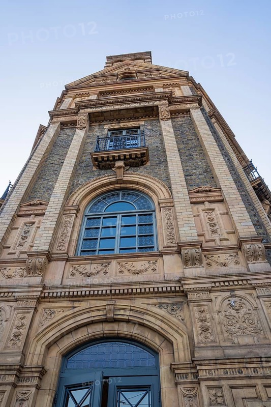Close-up of a historic building with impressive brick façade and decorated windows, Dublin, Ireland