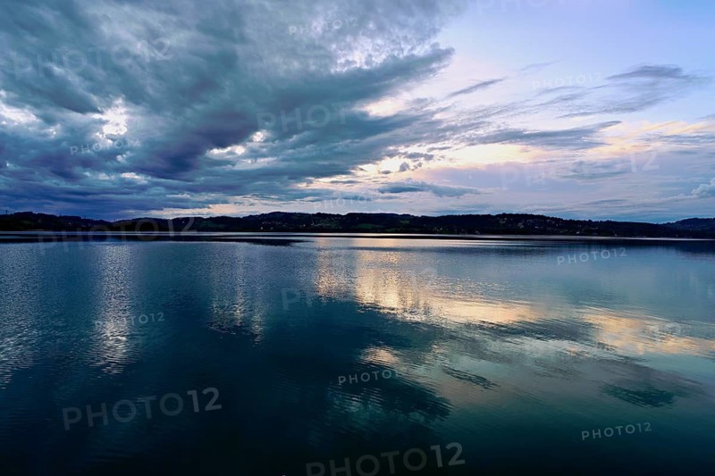 Cloud formation over Lac d'Aiguebelette, Large Natural Lake, at the foot of the Épine Mountains, Aiguebelette-le-Lac, Savoie Department, France