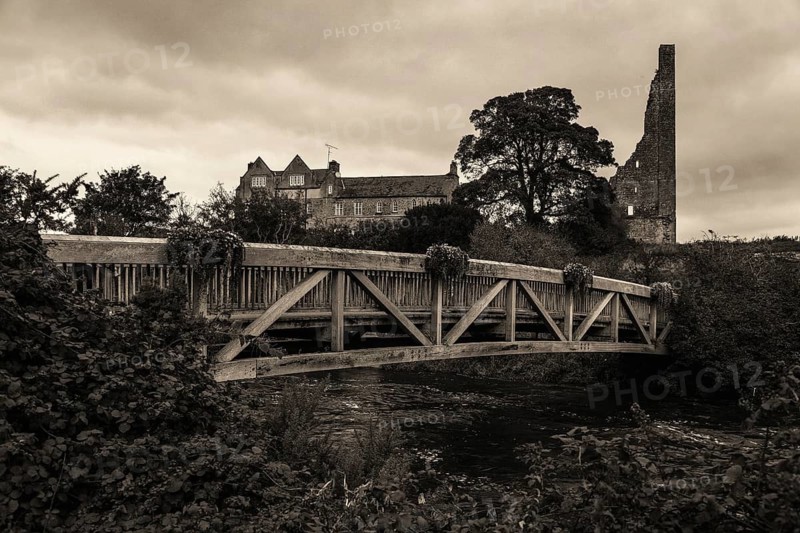 Bridge over the Boyne River and dilapidated watch tower of Dunmoe Castle in Navan, An Uaimh, a town in County Meath in Ireland