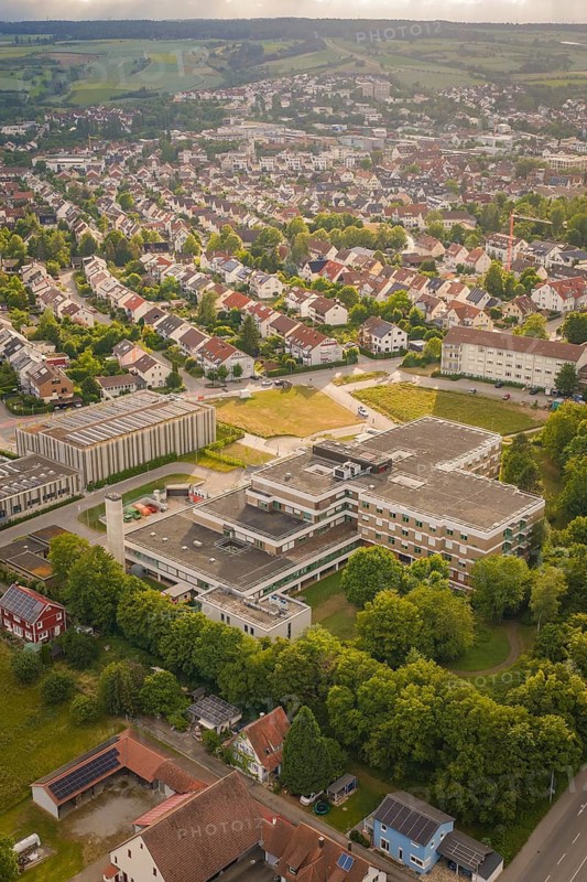 Aerial view of a city with a large central building and surrounding residential buildings, new IGZ, The Integrated Health Center Herrenberg, former Herrenberg Hospital, Böblingen district, Germany