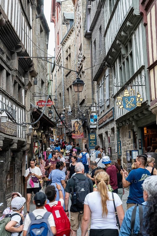 Mass tourism in the historic alleys of Rocky Island, Le Mont Saint Michel monastery island, tourist attraction, UNESCO World Heritage Site, Pontorson, Manche department, Normandy, France
