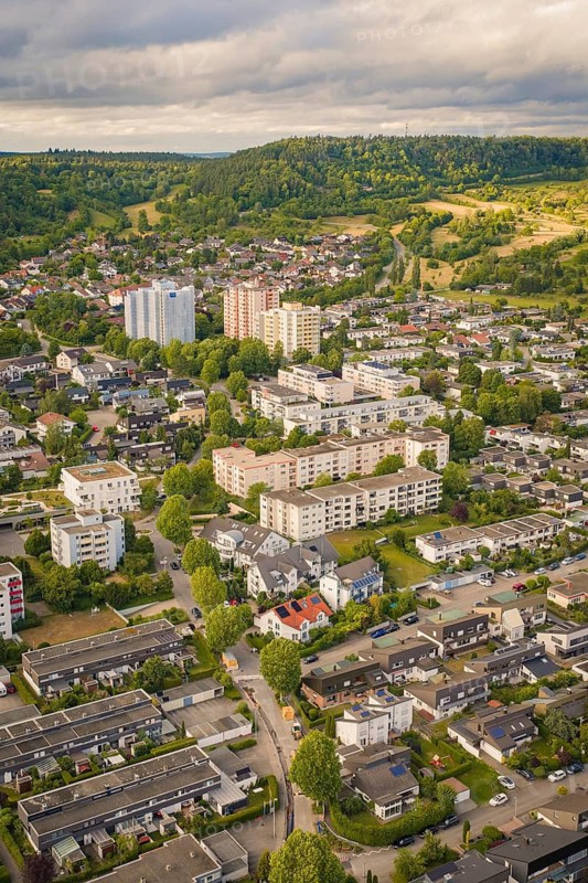 Districts with residential buildings and surrounding nature, high-rise buildings under a cloudy sky, Herrenberg, Böblingen district, Germany
