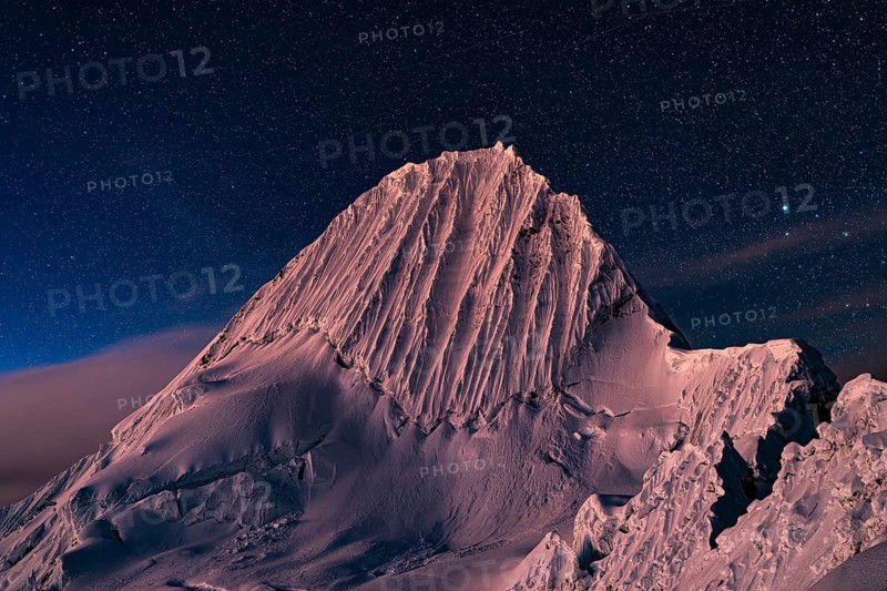 Alpamayo southwest face with glacier in evening light and starry sky, 5947 m, with the title of most beautiful mountain in the world, Cordillera Blanca, Huascaran National Park, northern Peru, Peru, South America