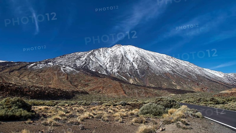 Snowy mountain with adjacent road under cloudless sky, Teide, Parque Nacional del Teide, Teide National Park, volcano, volcanism, UNESCO World Heritage Site, Tenerife, Canary Islands, Spain