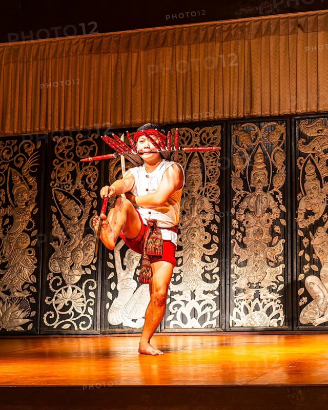 Young Thai man in traditional clothing in a historic show with knives and swords, Old Chiang Mai Cultural Center, Chiang Mai, Thailand