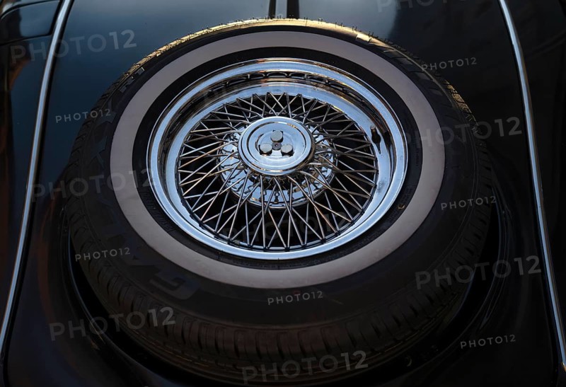 Close-up of spare wheel Spare tyre on the rear Oldtimer Mercedes-Benz 500 K Special Roadster 1936 (internally W29) Sindelfingen body on a black wooden frame Luther city Wittenberg, Saxony-Anhalt, Germany