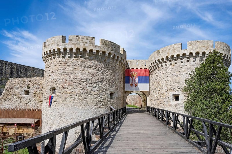 The iconic landmark Zindan Gate with the Serbian flag, part of the Belgrade Fortress and Kalemegdan Park Complex overlooking the Sava River and River Danube, Belgrade, Serbia