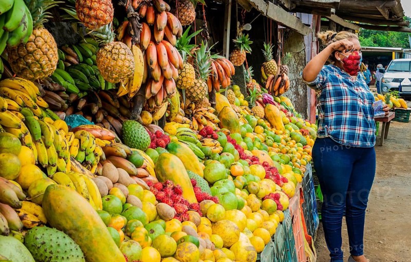 Woman selling fresh fruits, fresh fruit stall, fruit and healthy food concept, selling various fruits