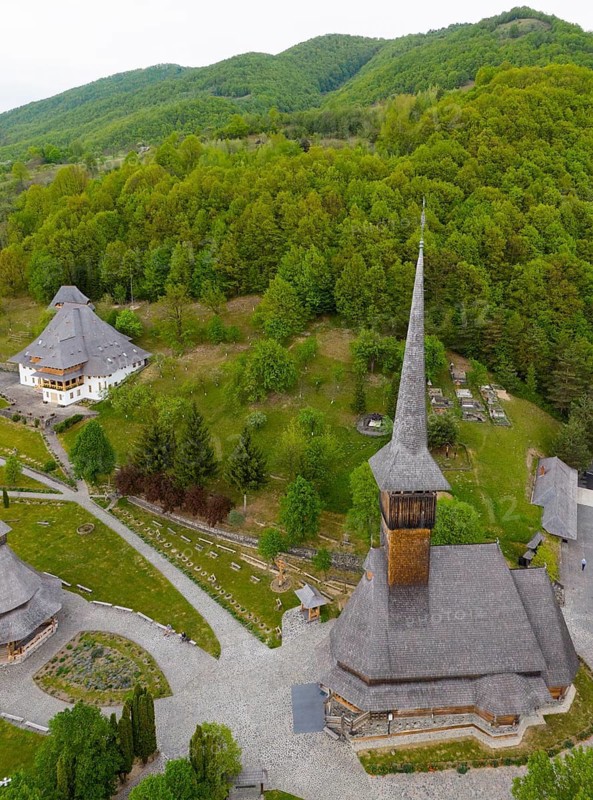 Rural complex with characteristic church towers against a dense forest backdrop, aerial view, Bârsana monastery, Barsana, Maramure?, Maramures, Maramuresh region, Romania