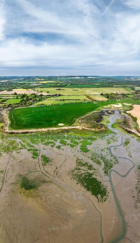 Panorama of Fields and Farms over Bosham Quay from a drone, Chichester Harbour National Landscape, Chichester, West Sussex, England, United Kingdom