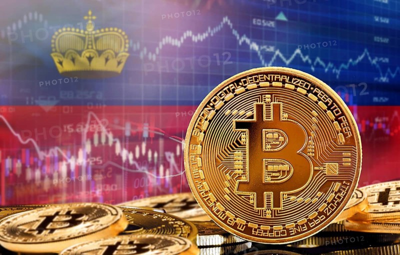 Investors in cryptocurrency and Blockchain Technology in Liechtenstein, Concept. Bitcoin with Liechtensteiner flag in the background