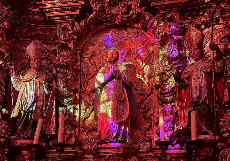 Colourful religious art, light show in a church, Porto, Portugal