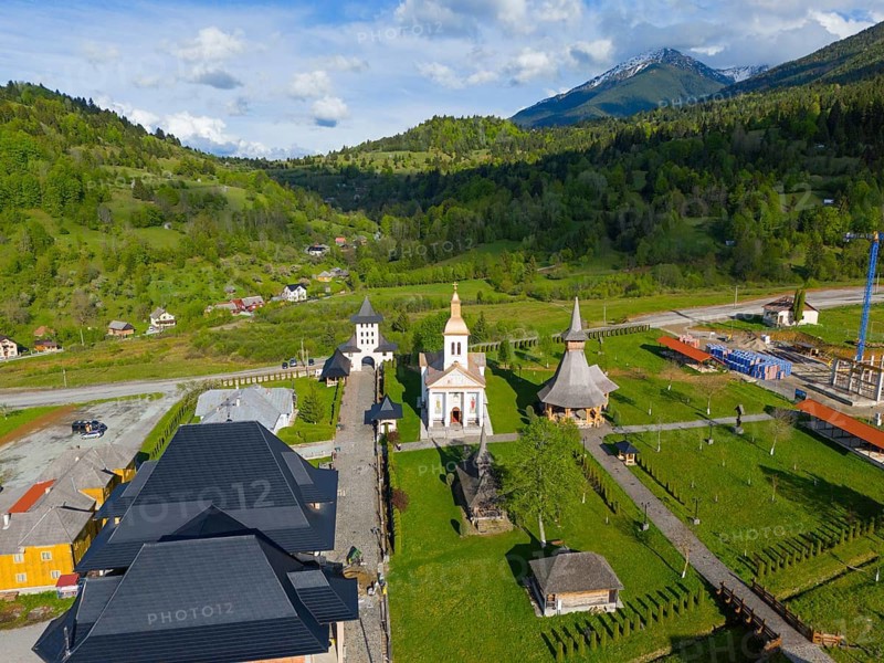 Church complex in a green landscape with mountains in the background, sunny sky with clouds, aerial view, Manastirea Adormirea Maicii Domnului, Izvorul Negru, Moisei monastery, Maramure?, Maramures, Maramures, Maramures region, Romania