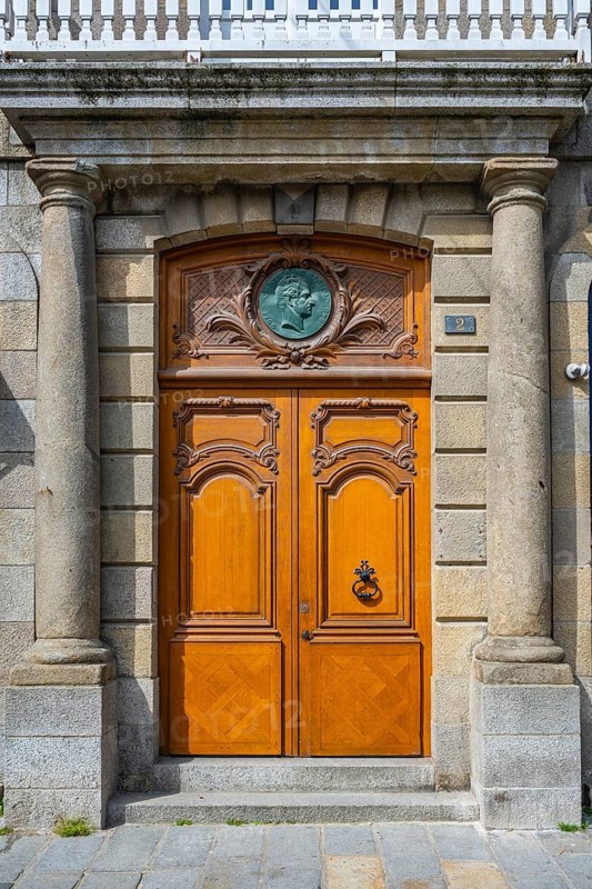 Entrance portal, wooden door to a town house in the historic old town of Saint Malo, Ille-et-Vilaine department, Brittany, France