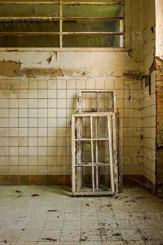 Dilapidated frame of windows leaning against a wall, former lung hospital and lost place health resort Grabowsee, Oranienburg, Brandenburg, Germany