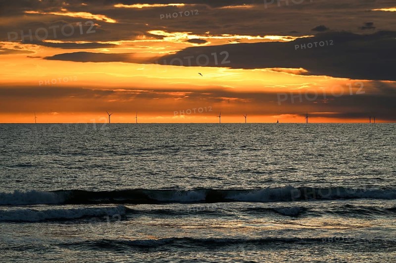 Large wind turbines, wind turbines at sunset at sea, surf, Houvig Beach, Denmark