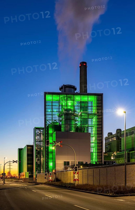 The Lausward combined heat and power plant in Düsseldorf, gas and steam turbine power plant, operated by Stadtwerke Düsseldorf and EnBW, in the harbour of Düsseldorf on the Rhine, green illuminated city window, the chimney of the Fortuna power plant unit, the power plant generates electricity, also traction current and district heating, North Rhine-Westphalia, Germany