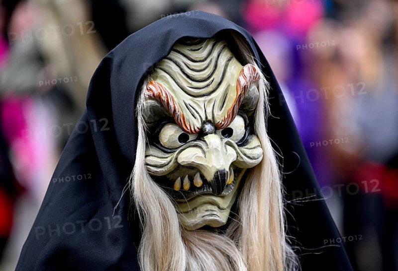 Member of a fools' guild in traditional Haes, fools' clothes, during the carnival procession in Achern, Ortenaukreis, Baden-Württemberg, Germany