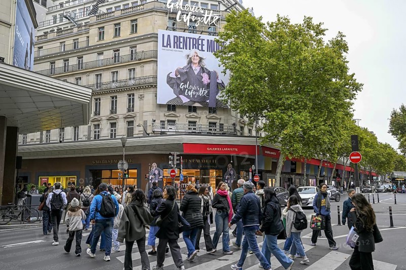 Passers-by in front of Galeries Lafayette, France's most famous department store, Boulevard Haussmann, 9th arrondissement, Paris, Île-de-France region, France