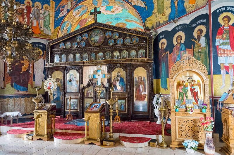 Orthodox church with ornate iconostasis and golden icons on a red carpet, Orthodox Church of Saint Archangel Michael, Biserica Biserica Sfântul Arhanghel Mihail, Corjeuti, Corjeu?i, North Region, Briceni District, Republic of Moldova, Moldova