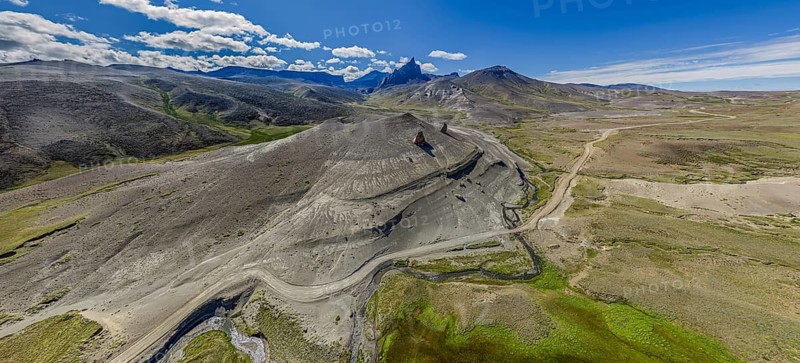 Road Ruta 41, gravel road, arid landscape, Mt. Cerro Boleadoras, volcano-shaped rock formation, Los Antiguos - Paso Roballo, aerial view, Argentina