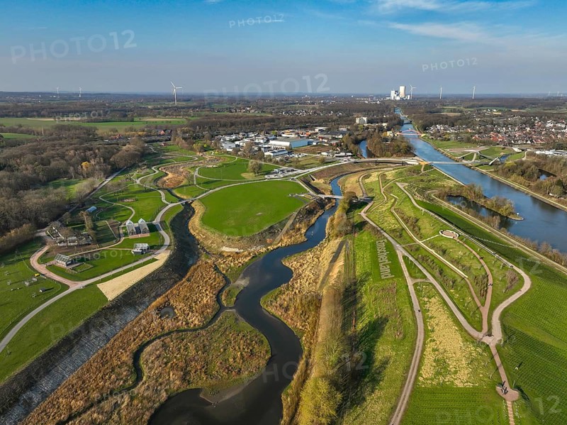 Castrop-Rauxel, North Rhine-Westphalia, Germany - EMSCHERLAND adventure park, new nature and water adventure park on the restored Emscher, at the Emscher water cross with the Rhine-Herne Canal on the city limits of Recklinghausen to Castrop-Rauxel. A new vineyard in front. Flood protection through area expansion. The ecological focus at the confluence of the Suderwicher Bach and Emscher rivers will also be a future garden of the IGA 2027 International Garden Exhibition. Before the restoration, the river system of the Emscher was an open, aboveground waste water channel, mixed water channel with surface water and waste water. Back right, the new bridge jump over the Emscher. On the horizon, the Datteln 4 power plant