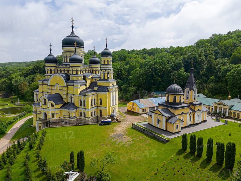 Orthodox monastery with yellow walls and domes, nestled in green landscape, aerial view, Hîncu monastery, Hâncul, Hincu, Hancu, Hancul, located near the village of Bursuc, Nisporeni district, Republic of Moldova, Moldova