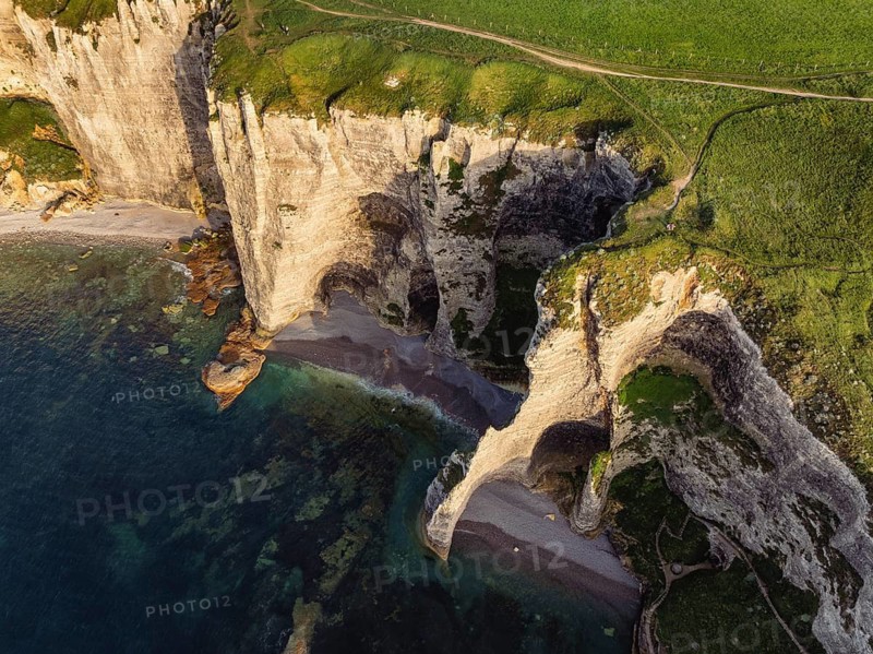 Aerial view of rugged chalk cliffs in the evening sun, Falaise d'Amont, Étretat, Alabaster Coast, La Côte d'Albâtre, Chalk Cliffs, English Channel, Seine-Maritime, Normandy, France