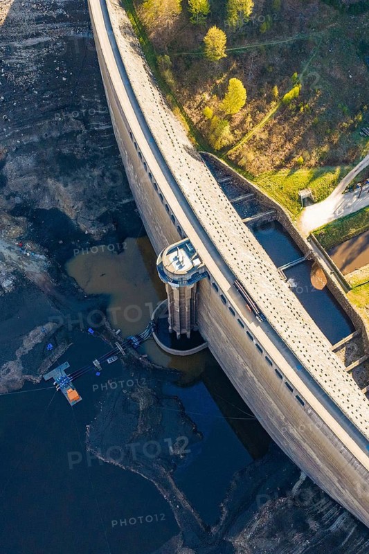 Aerial view of a large dam with water and surrounding forest, emptied Schwarzenbach dam, Forbach, Black Forest, Germany