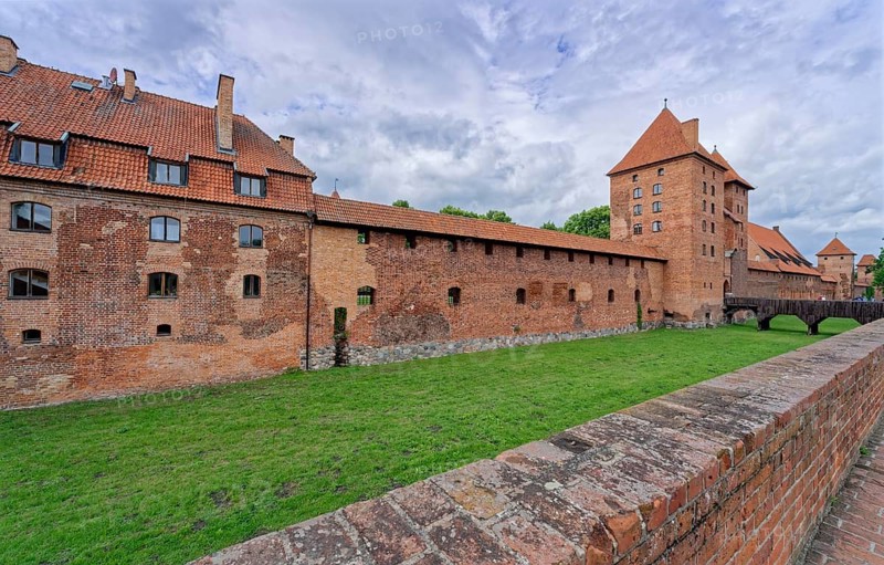 External fortifications of Malbork. The Malborku Castle, Zamek w Malborku, is a neo-Gothic lowland castle built by the Teutonic Order, and is a UNESCO World Heritage Site. Malbork, Pomerania, Poland