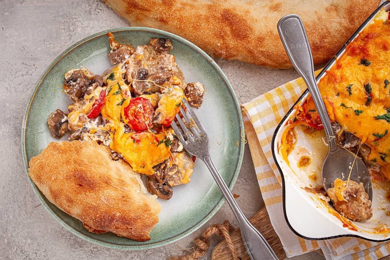 Madame Bovary's Georgian dish, chicken fillet with mushrooms, tomatoes and cheese, baked in a mold