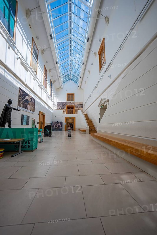 Light-flooded museum walkway with high ceiling and modern works of art on the walls, National Gallery of Ireland, Dublin, Ireland