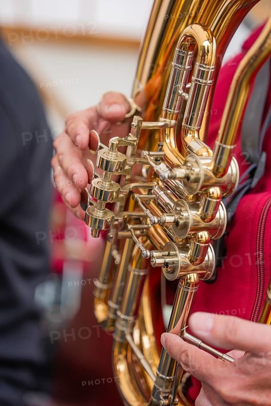 Close-up of a golden wind instrument held by one person, Father's Day, Forest Festival, Aidlingen, Böblingen district, Germany