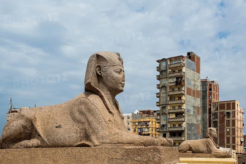 Roman archaeological site in the middle of the city and skyscrapers, Pompey's Column, Alexandria, Egypt