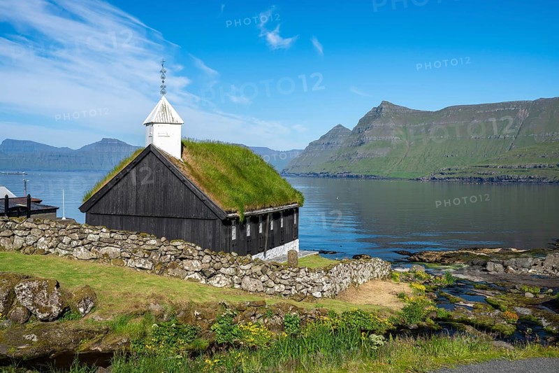 Funningur wooden church, church with grass roof on the fjord, Eysturoy island, Faroe Islands, Denmark