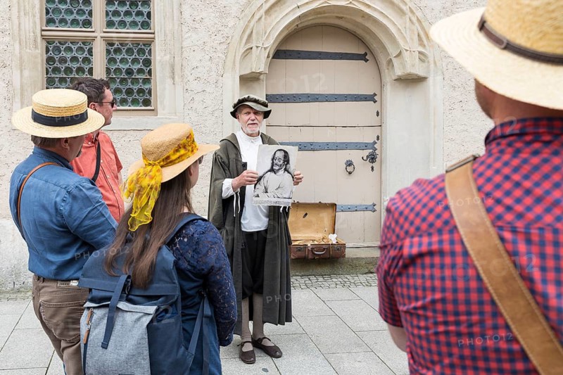 City tour with Philipp Melanchthon in historical costume in the old town, here in front of the Melanchthon House, Luther city Wittenberg, Saxony-Anhalt, Germany