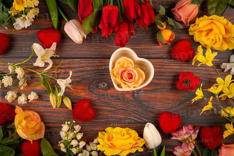 Flowers and hearts on wood